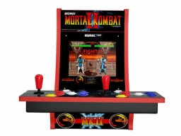 Red and black game machine with joystick and buttons