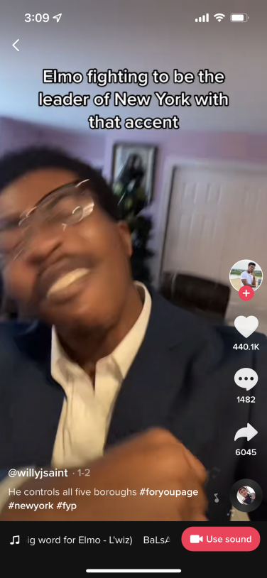 Screenshot of TikTok showing a Black man fist bumping his chest, on screen text reads "Elmo fighting to be the leader of New York with that accent."