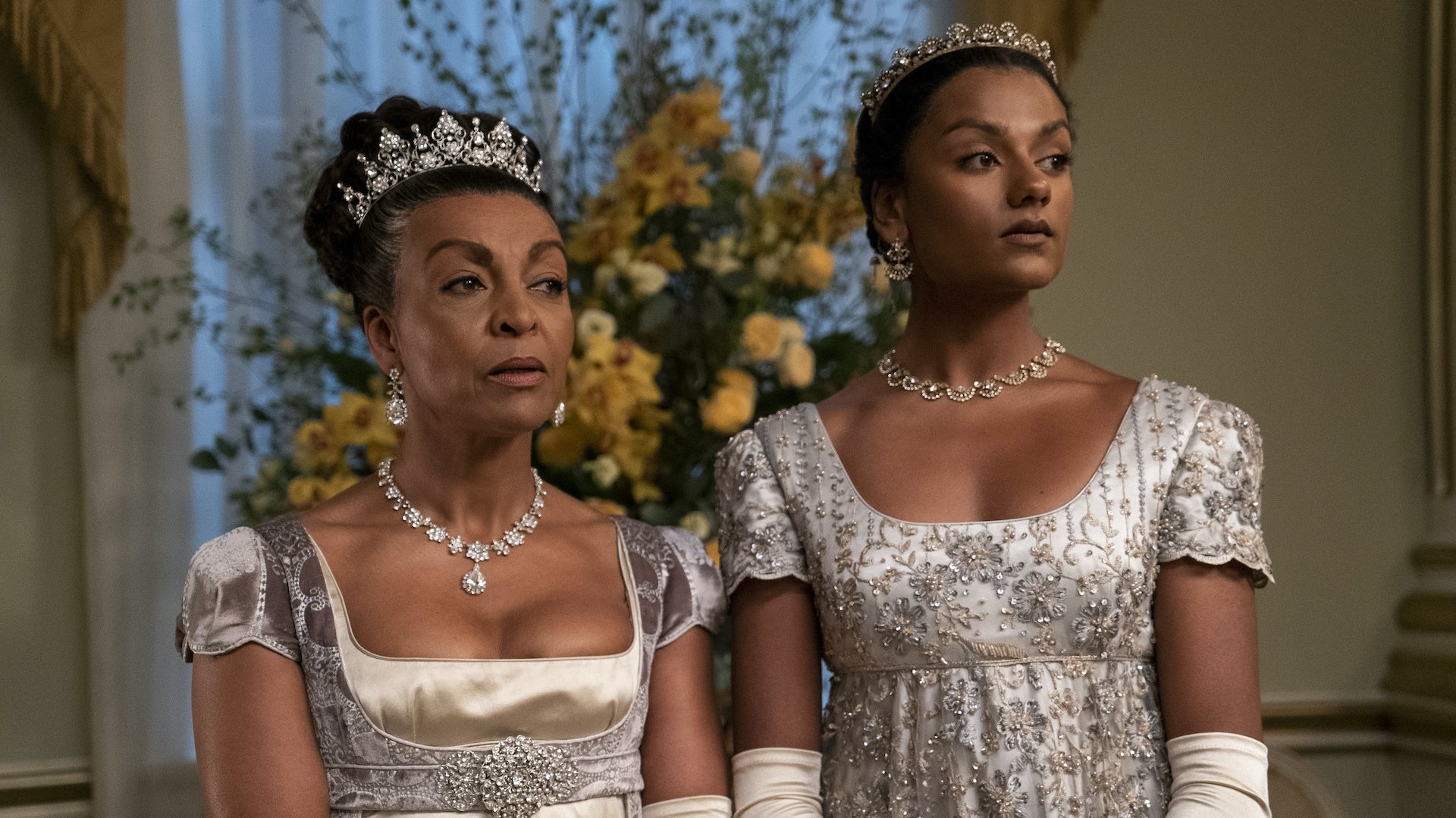 Medium shot of two women in Regency gowns; still from "Bridgerton."