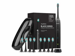 Black electric toothbrush with eight spare brush heads next to case and box