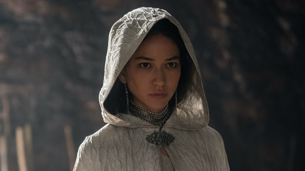 Closeup of woman wearing a white hooded cloak.