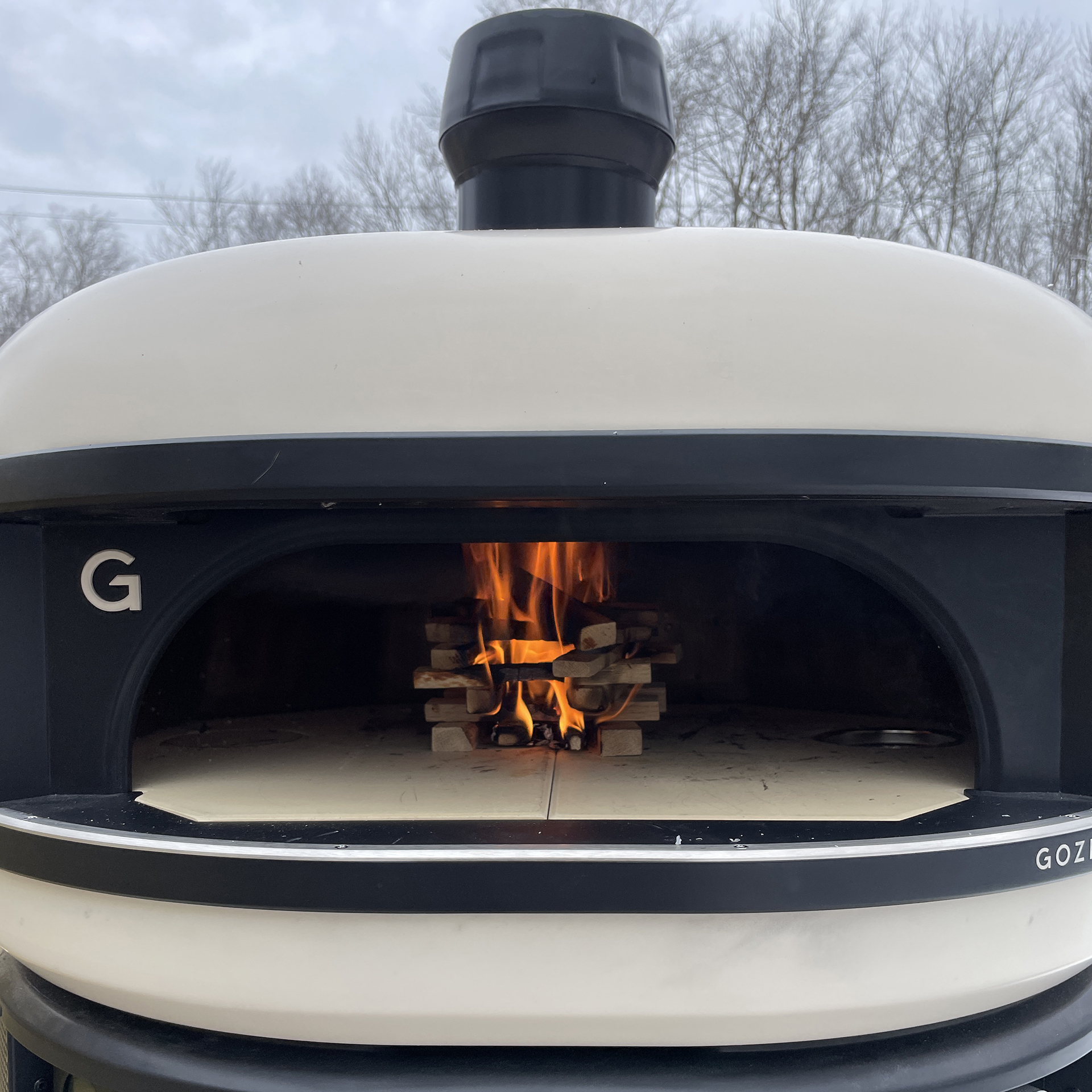 Gozney dome with small fire inside
