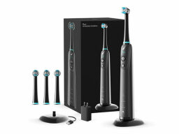 Black electric toothbrush with charging base and three brush heads next to box