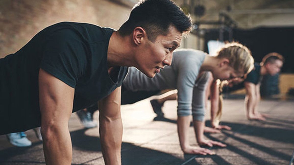 Row of people in pushup position