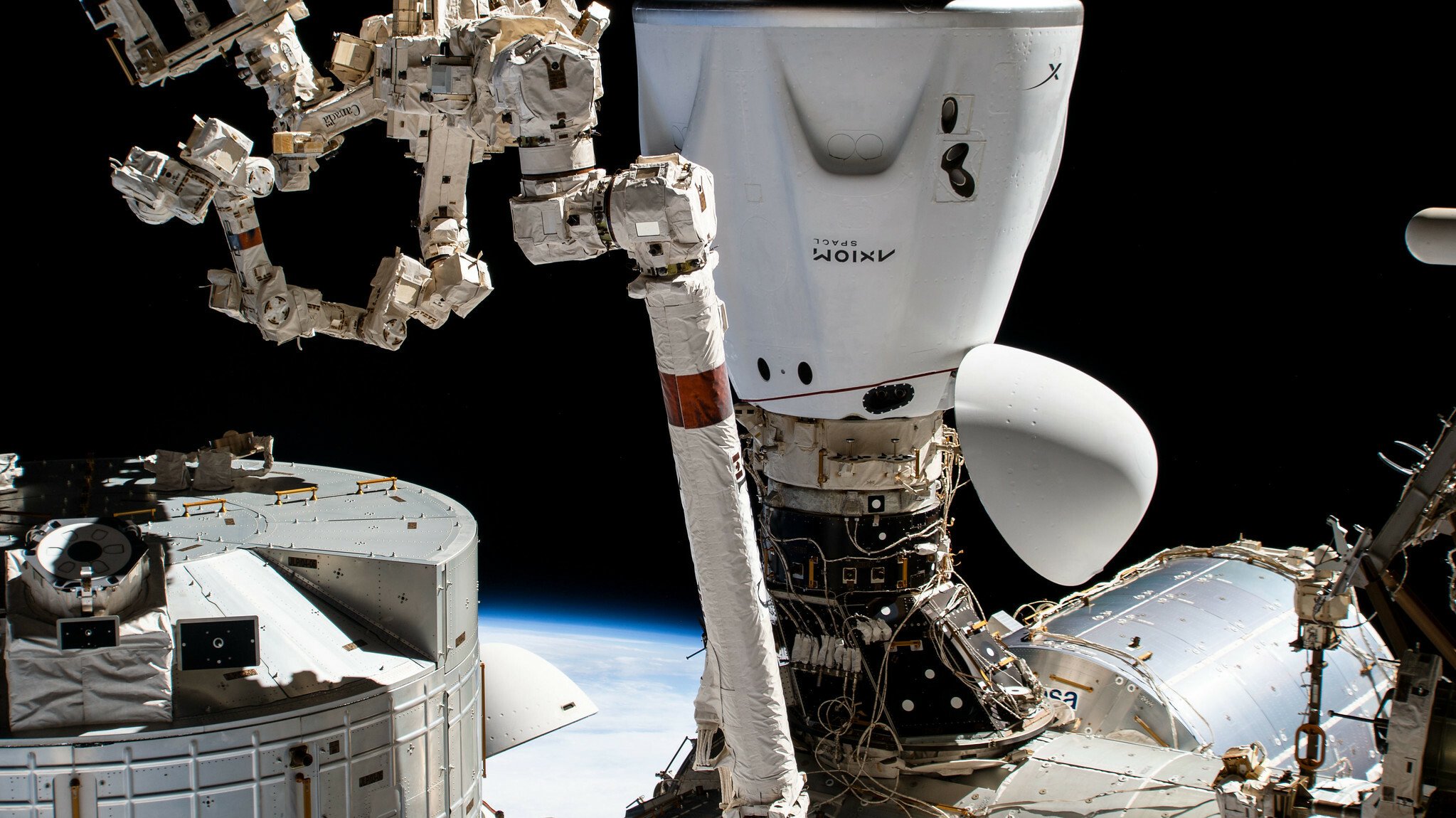 The SpaceX Dragon Endeavour crew ship is pictured docked to the Harmony module's space-facing international docking adapter.  