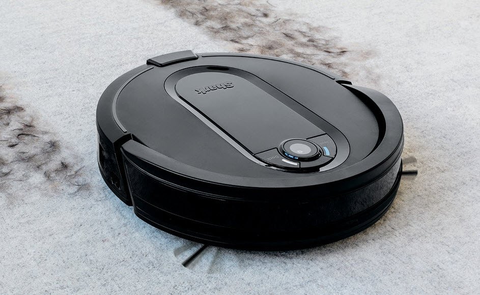 Shark AV1010AE IQ robot vacuum vacuuming up hair on carpet