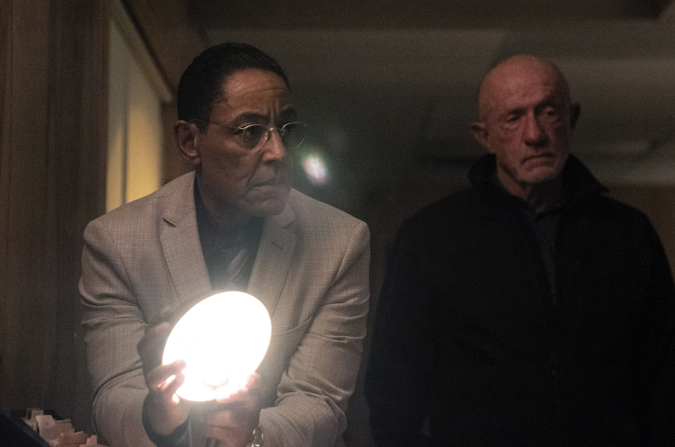 Two men (Giancarlo Esposito as Gus on "Better Call Saul" and Jonathan Banks as Mike) standing in front of a lamp.