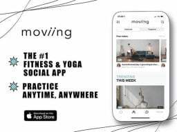 Phone screen open on moviing app with videos of exercises and ad text next to it