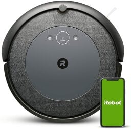 a roomba i4 next to a smartphone displaying the irobot app