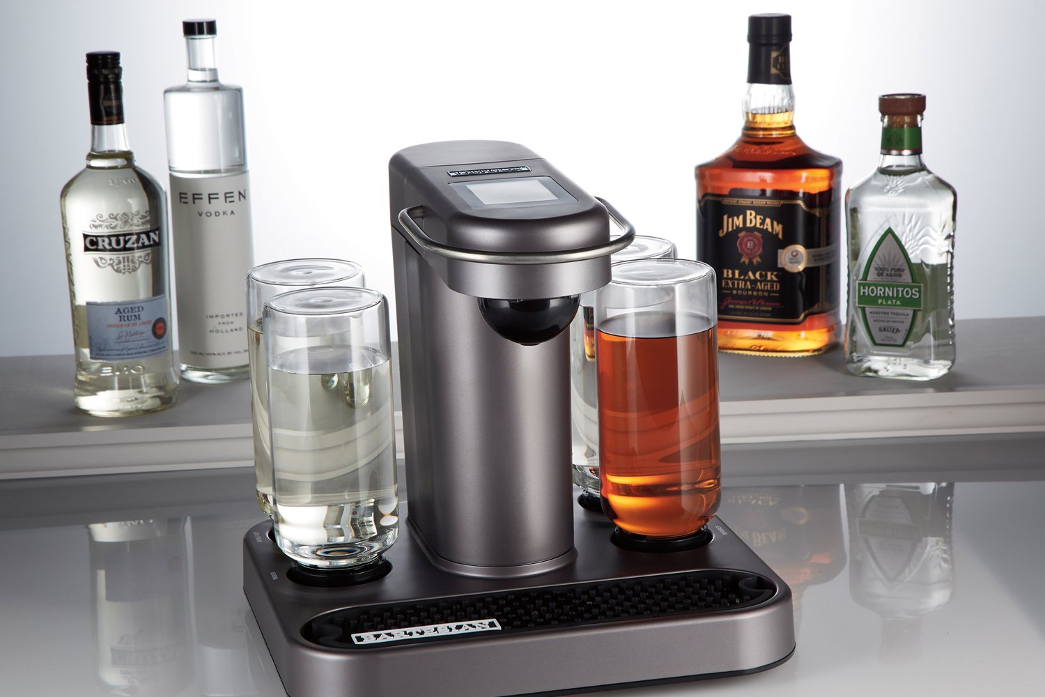 Bartesian cocktail maker with various bottles of alcohol in background