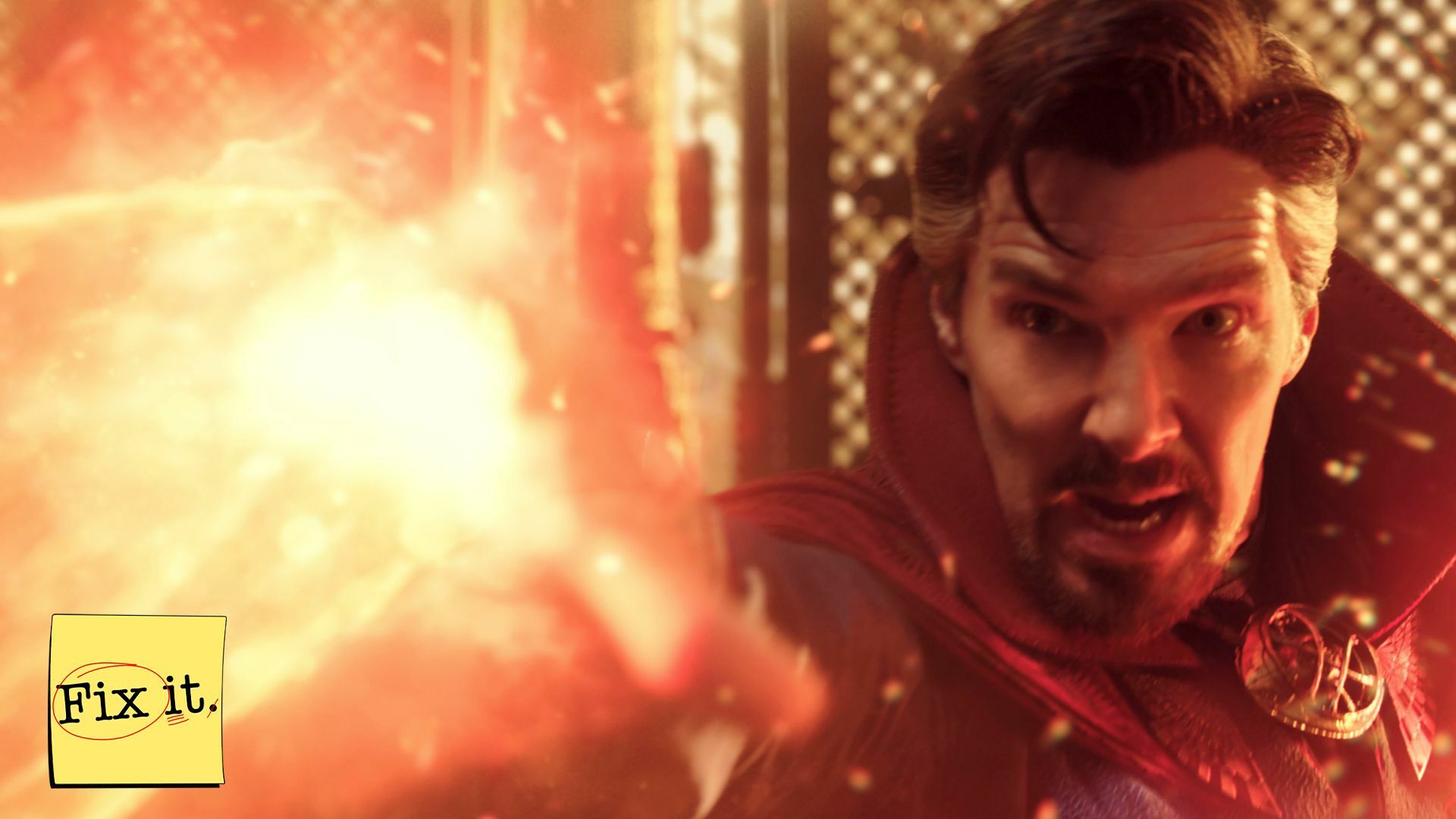 A man in a high-collared cloak shoots a blast of orange energy from his outstretched hand.