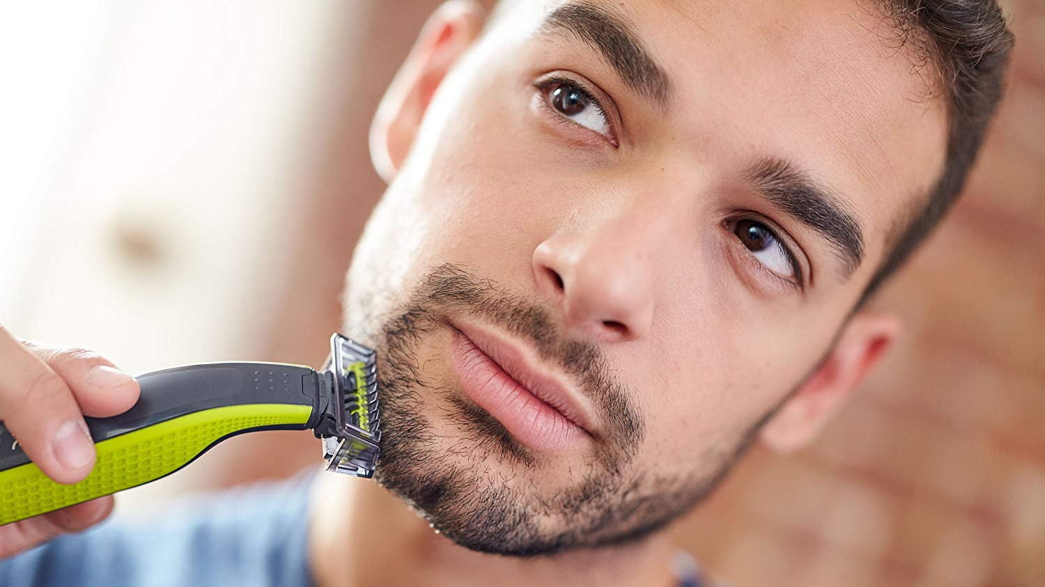 Man trimming his beard