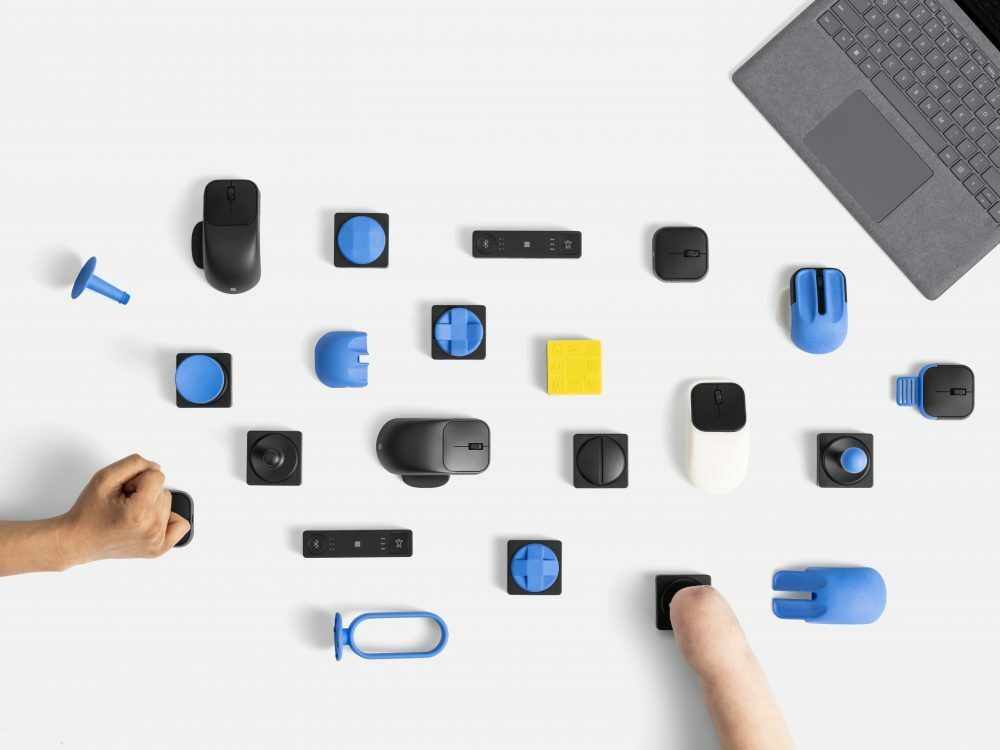 Image of Microsoft accessories being used by someone with a hand and someone without a hand