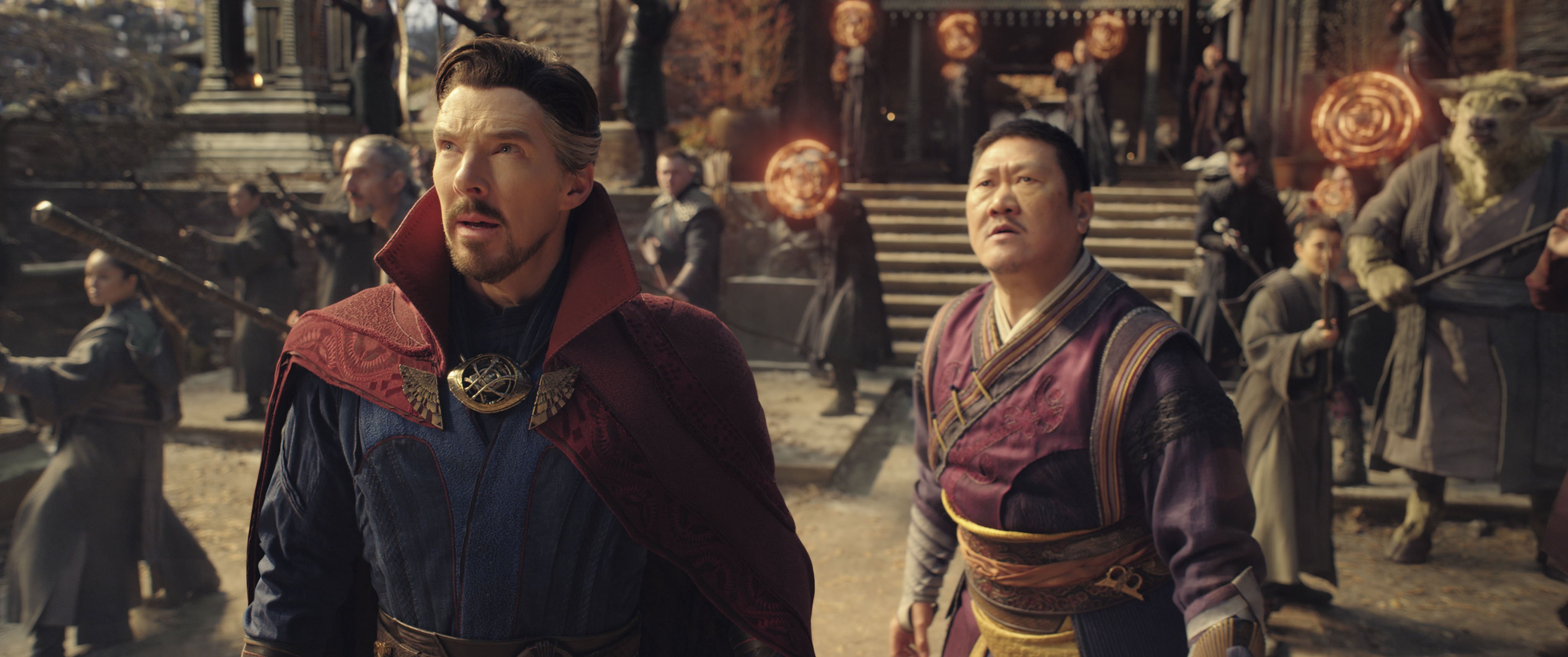 Doctor Strange and Wong looking up. 
