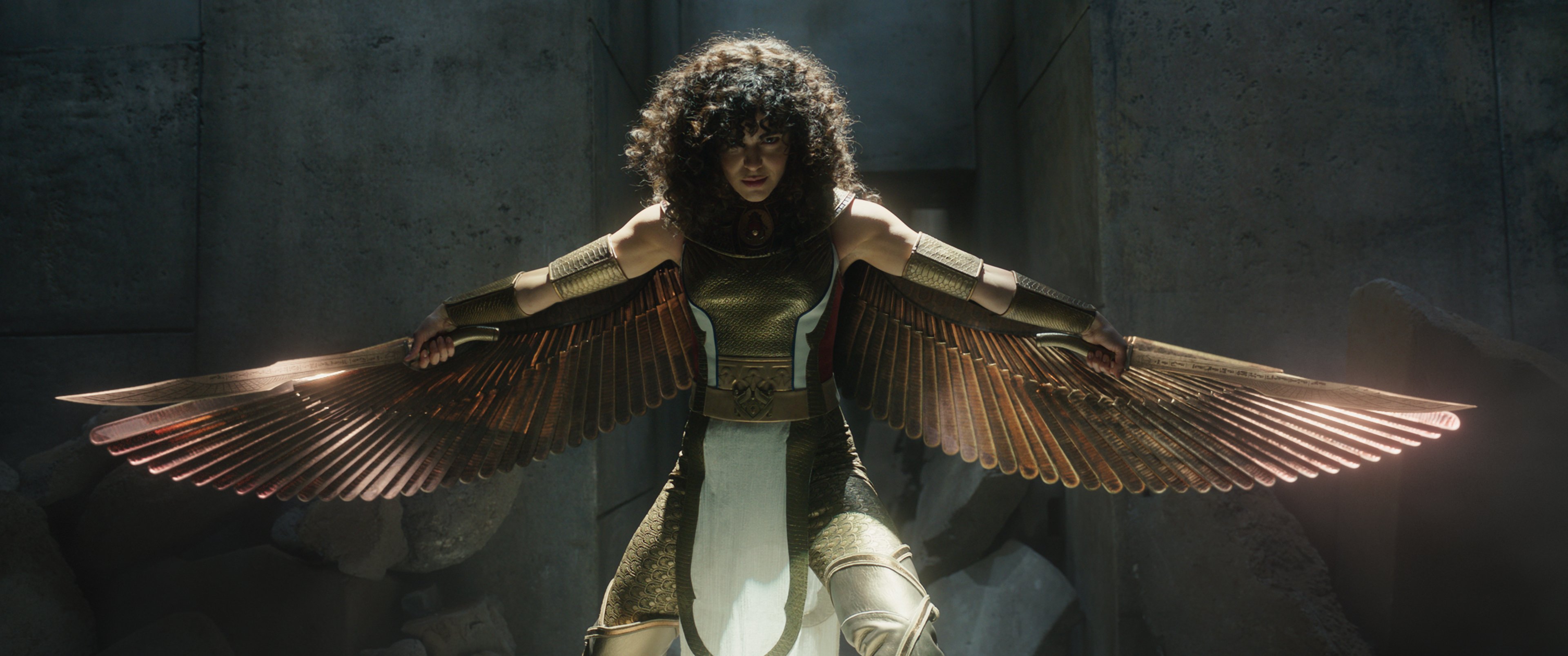 A woman in a superhero suit with metallic wings.