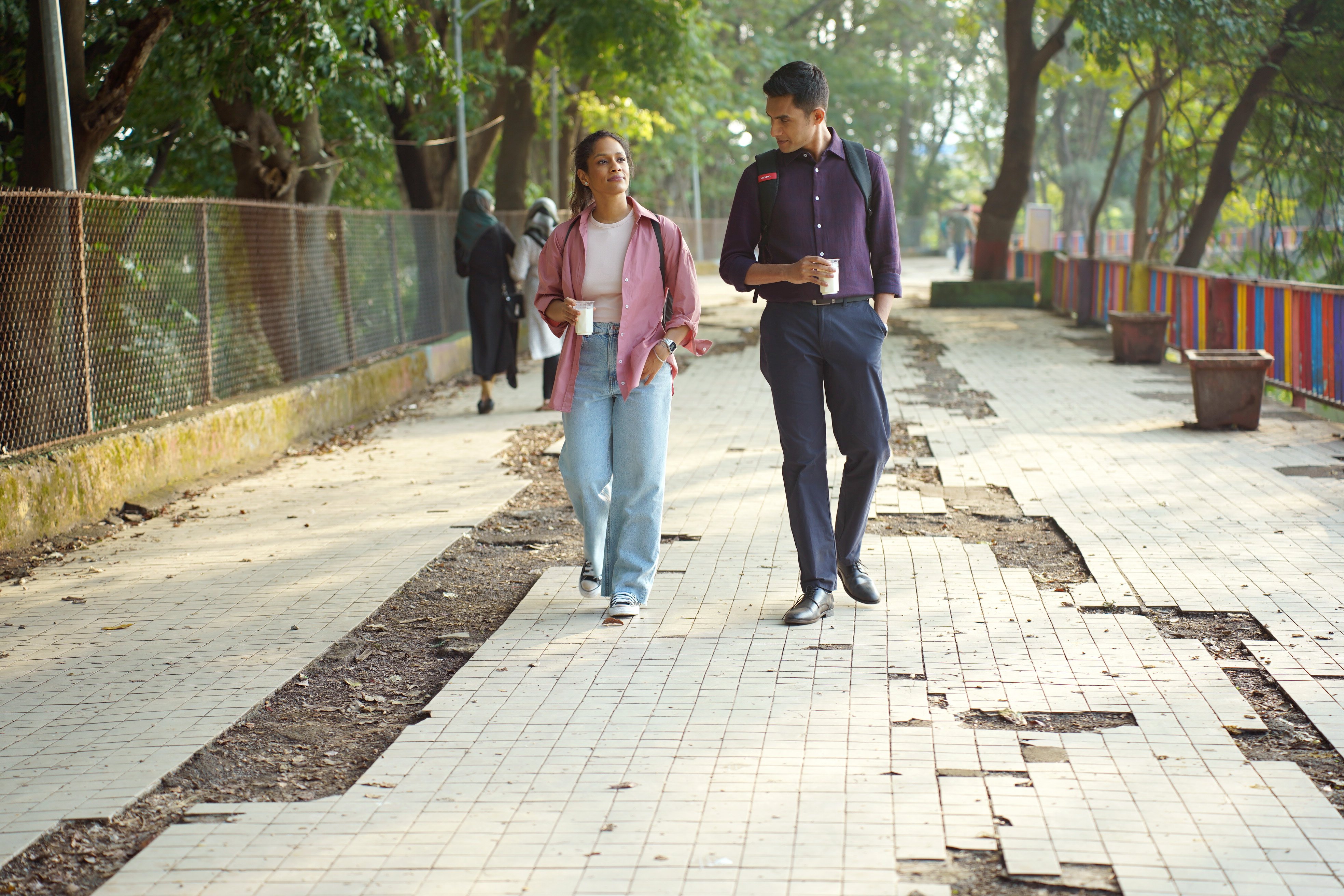 A still from 'Modern Love Mumbai' with two male and female characters walking alongside each other.