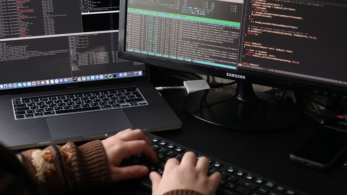 Hands typing on keyboard