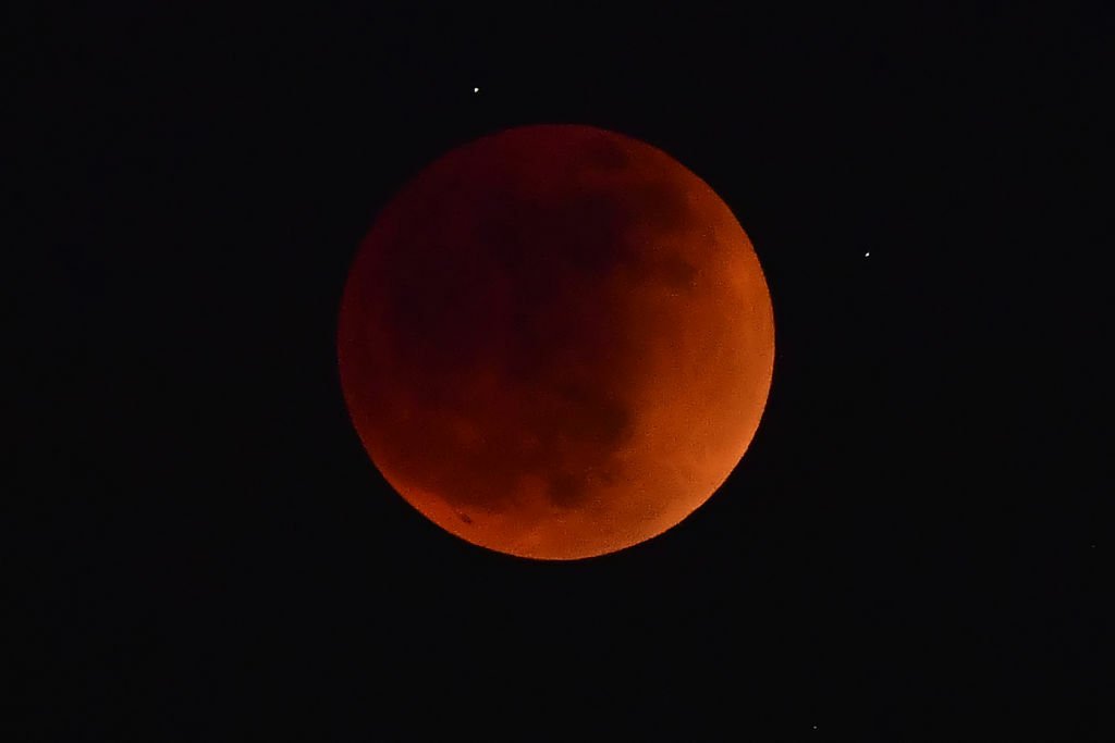 Moon turning red in a total lunar eclipse