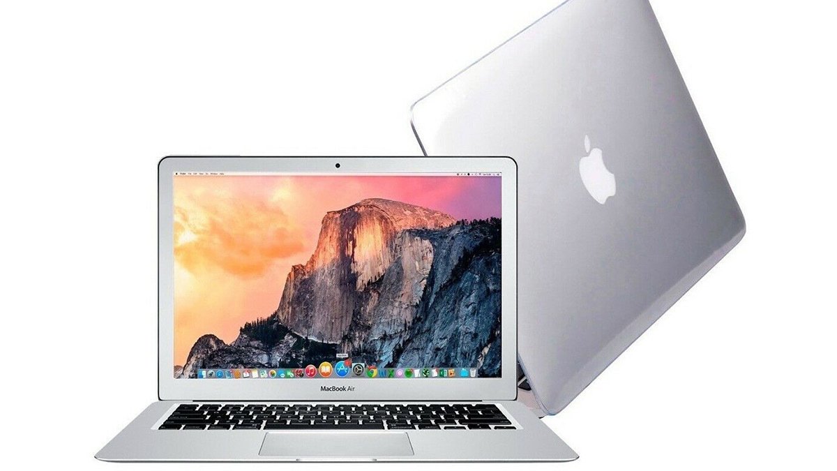 Silver macbook with mountain desktop wallpaper and back of macbook visible behind it