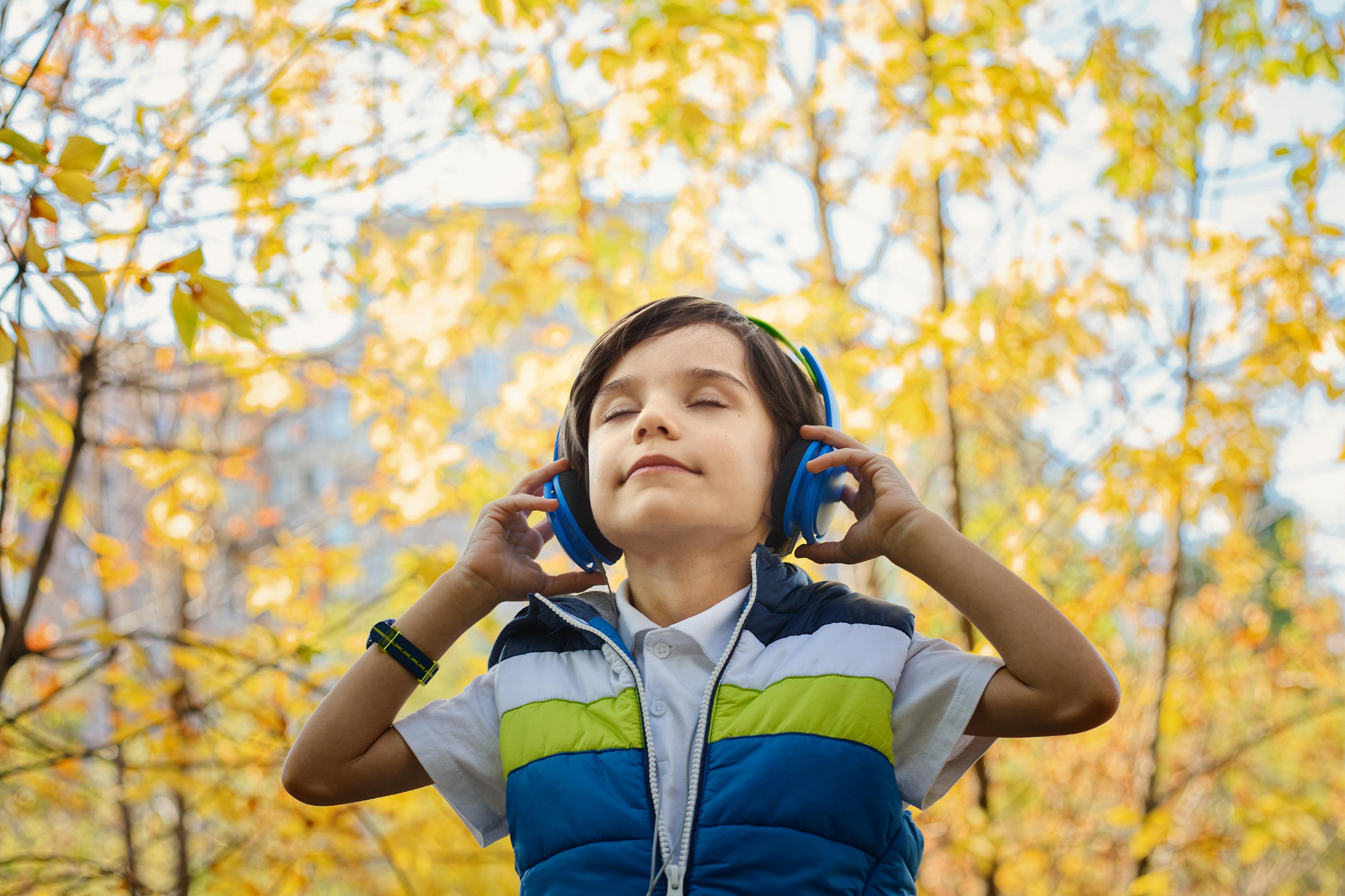 Little boy listening to headphones