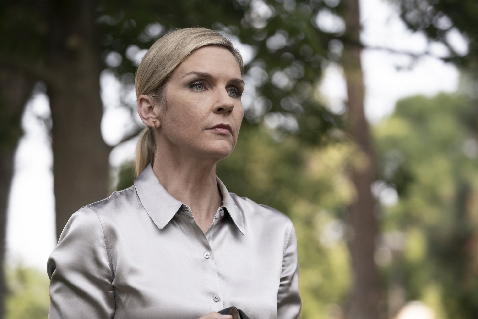 A woman (Rhea Seehorn as Kim Wexler) standing outside.