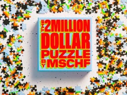 Box of 2 million dollar puzzle with puzzle pieces scattered around it