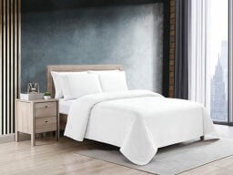 White bed in modern bathroom