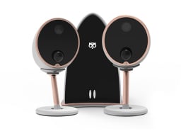 Two round cameras on stand in front of triangular gateway