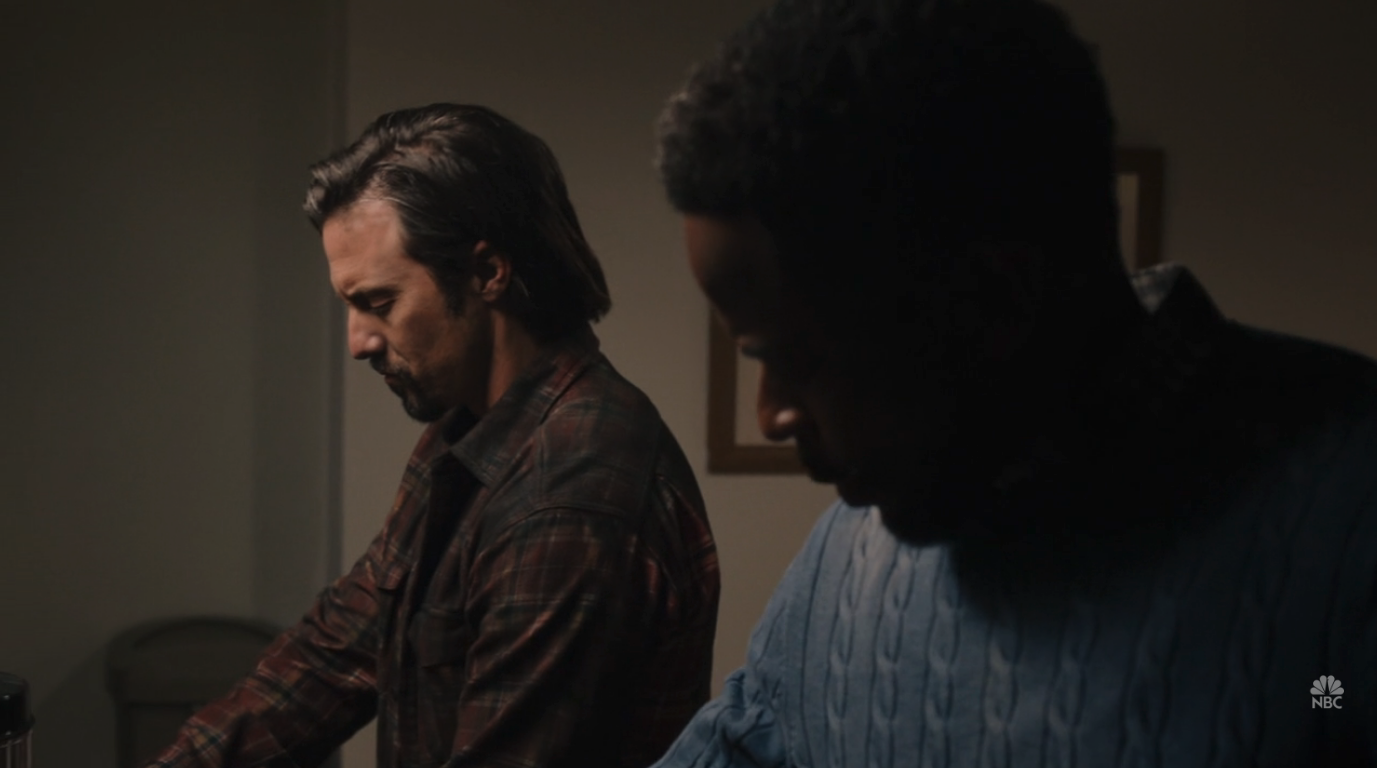 Two men standing next to each other in a hospital waiting room.