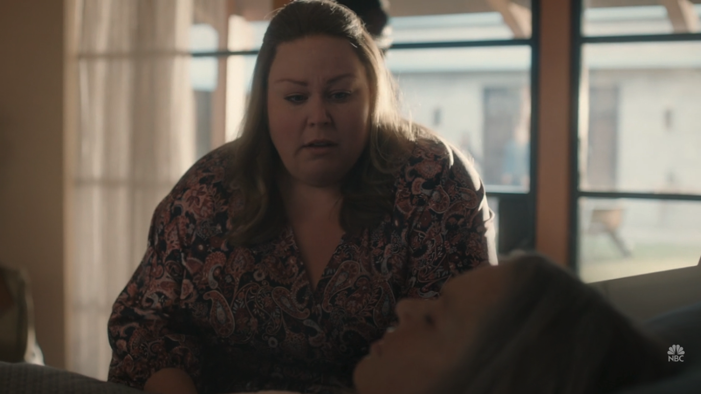 A woman (Chrissy Metz) standing over another woman (Mandy Moore) who's in bed.