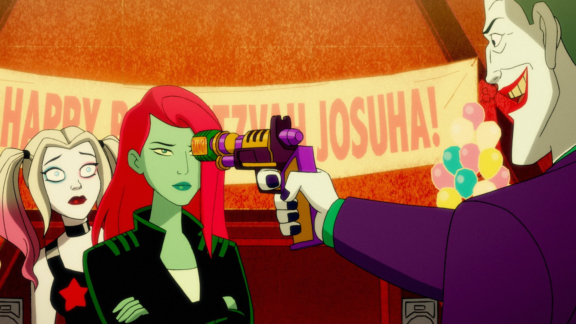 The Joker threatens Poison Ivy and Harley Quinn.
