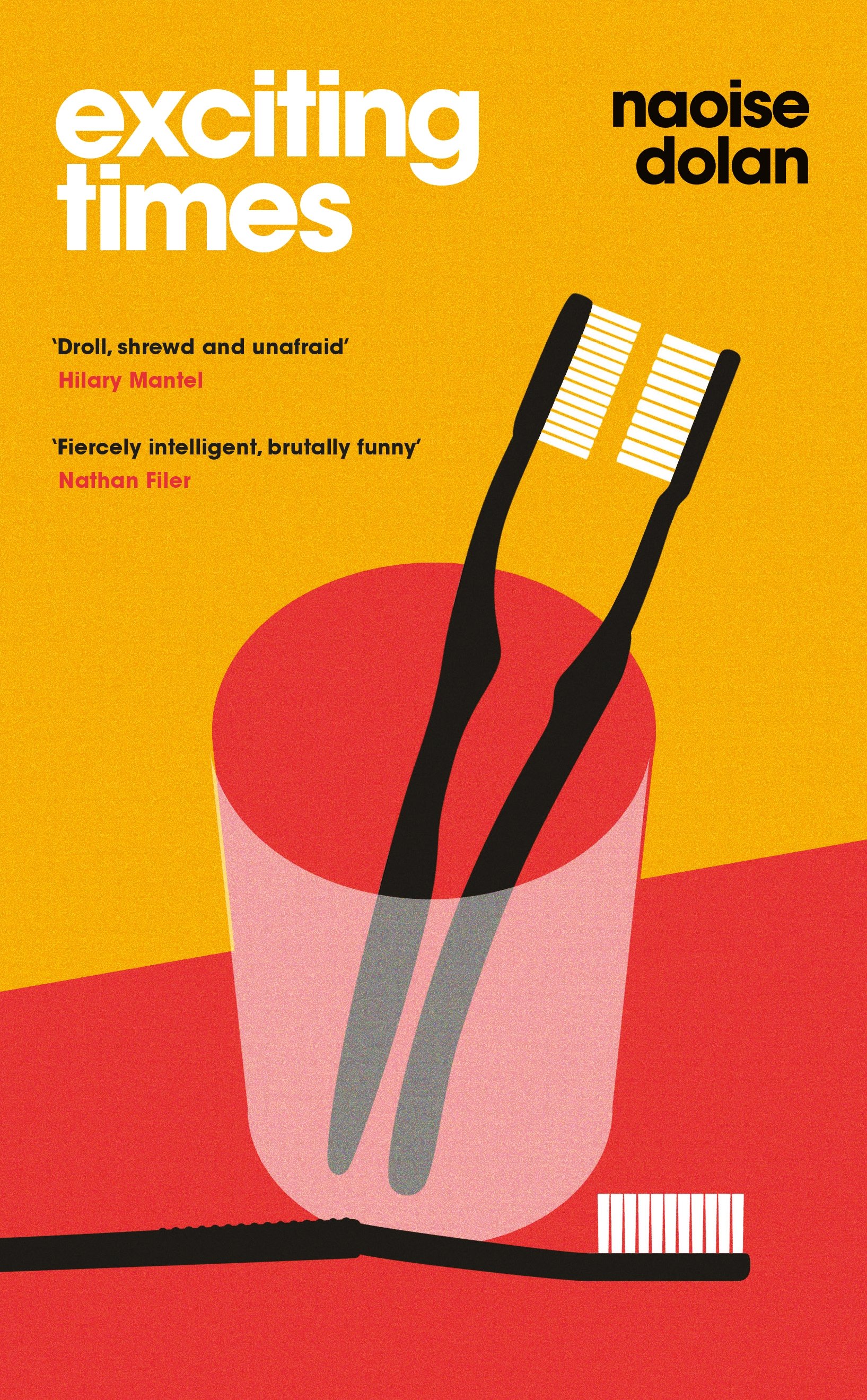 Two toothbrushes in a cup, with a third toothbrush lying sideways. The cover for 'Exciting Times'