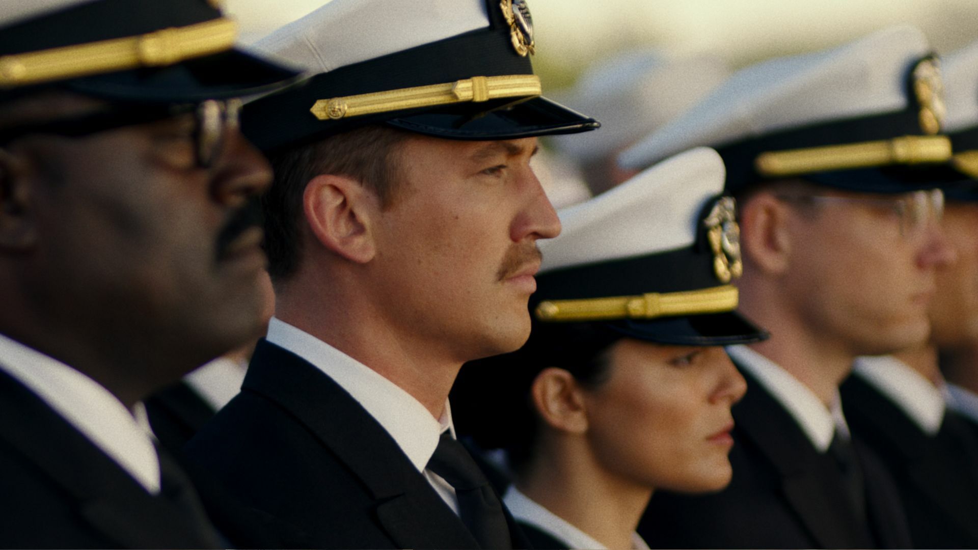 Naval pilots in uniform line up