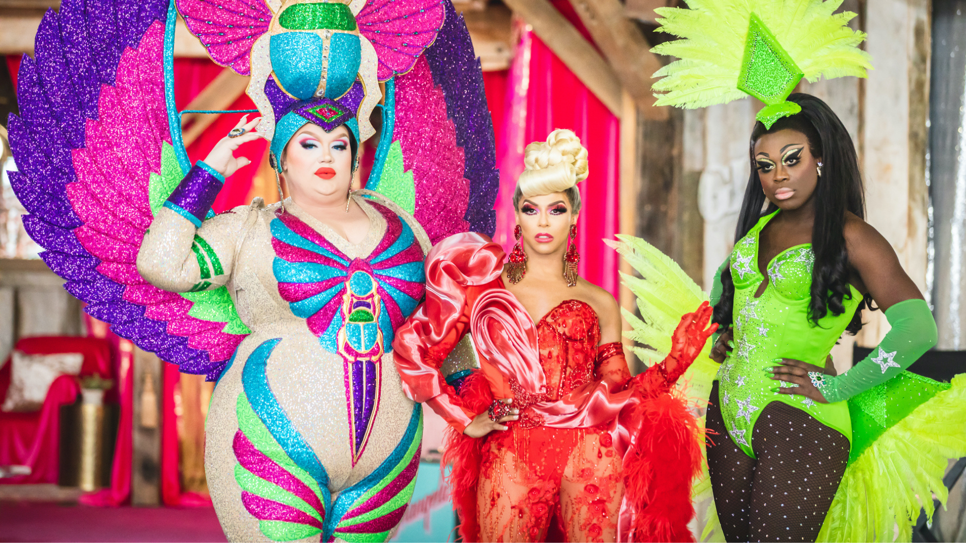 Three drag queens strike a pose