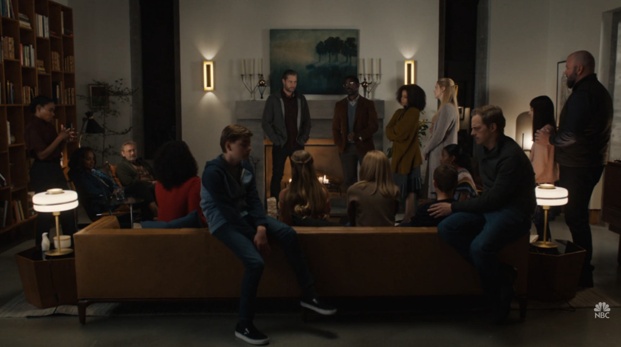 The cast of "This Is Us" together in a living room.