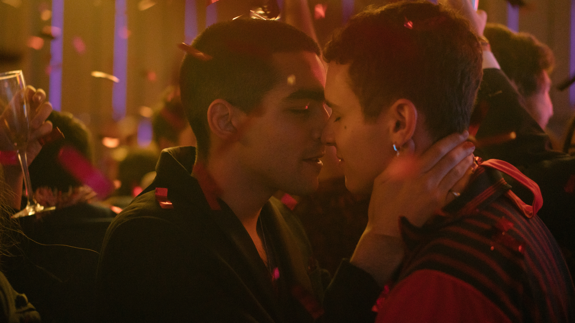 A couple kisses.