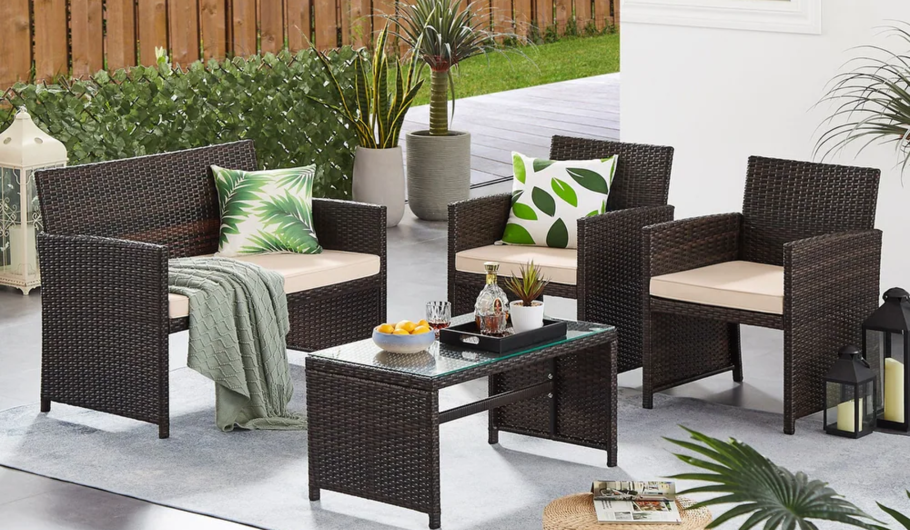 Rattan patio furniture with table arranged outside
