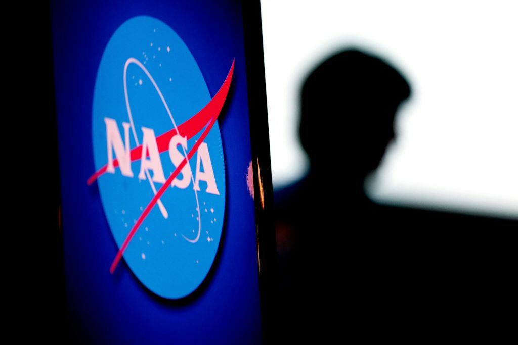NASA logo next to silhouette