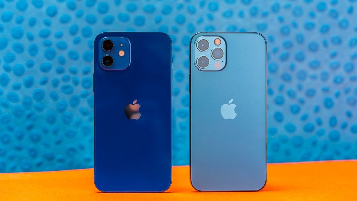 Two blue iPhones on an orange background