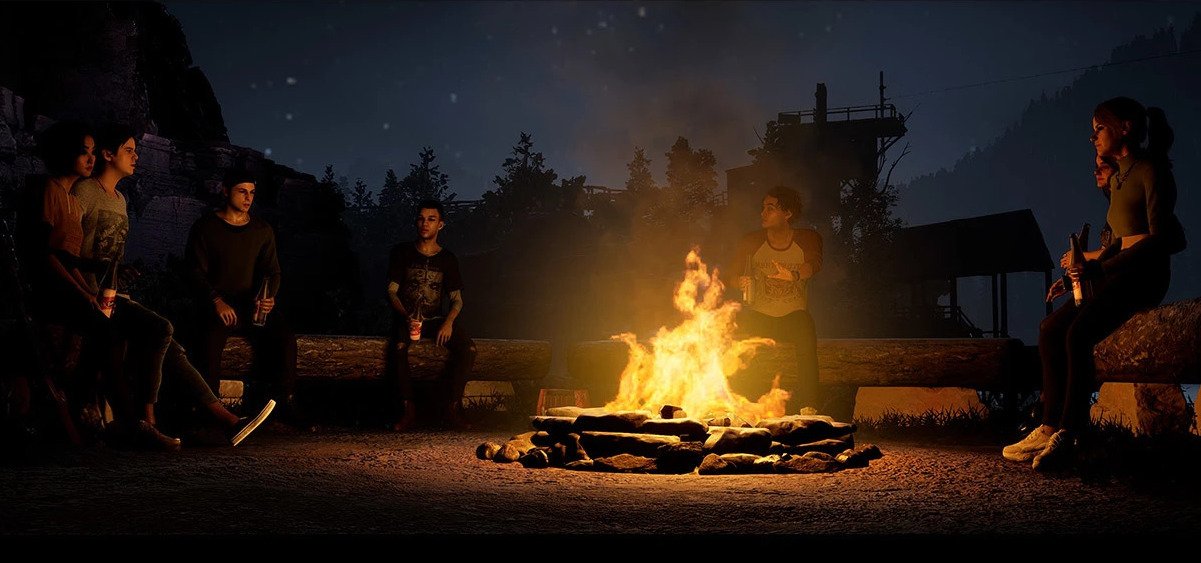 Teen horror movie characters sit around the camp fire in 