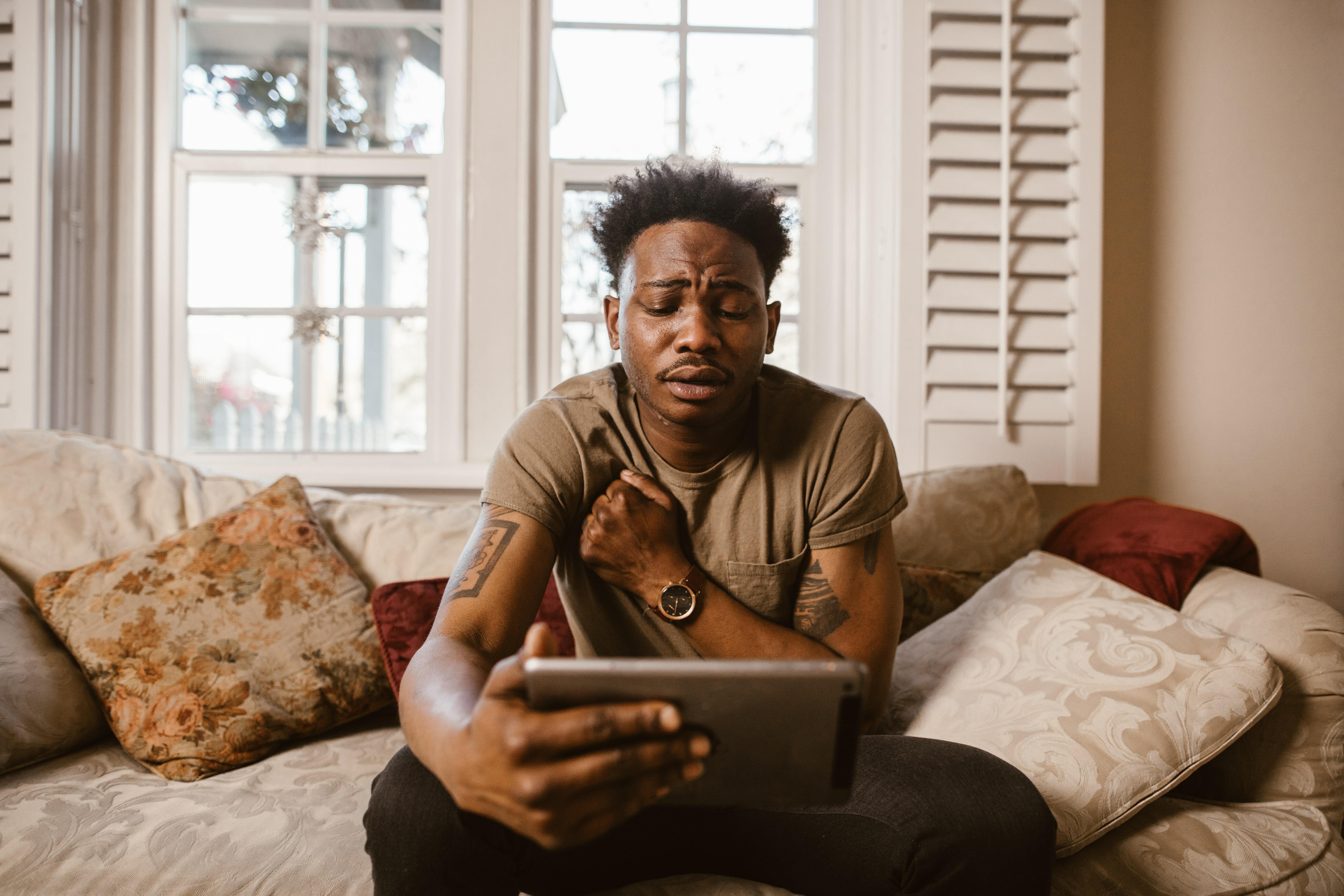 Man looking at tablet