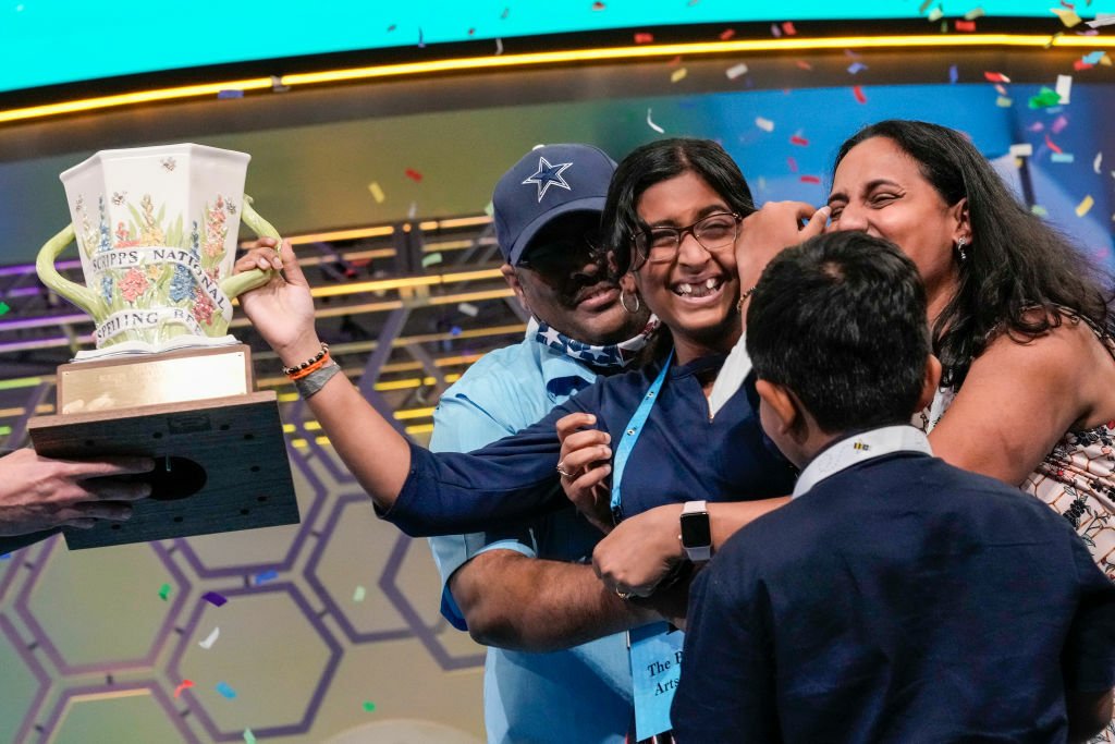 14-year-old Harini Logan from San Antonio, Texas is embraced by family after winning the Scripps National Spelling Bee at the Gaylord National Harbor Resort on June 2, 2022 in Oxon Hill, Maryland.