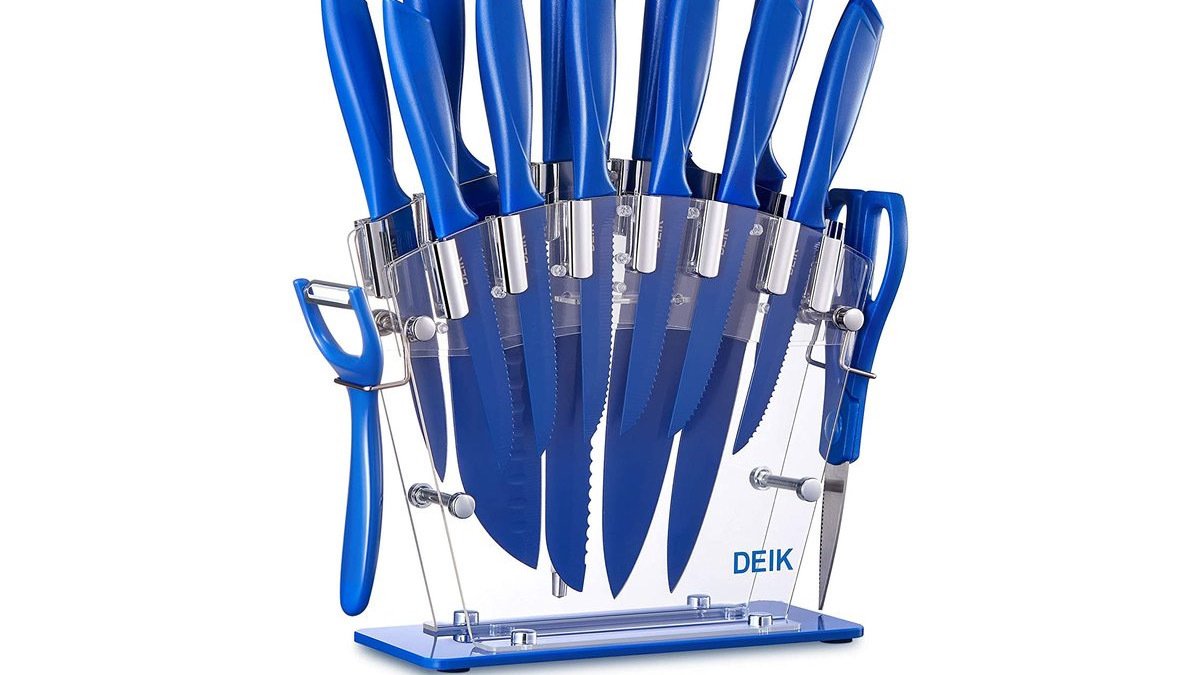 Blue knives in clear stand with scissors and peeler at sides