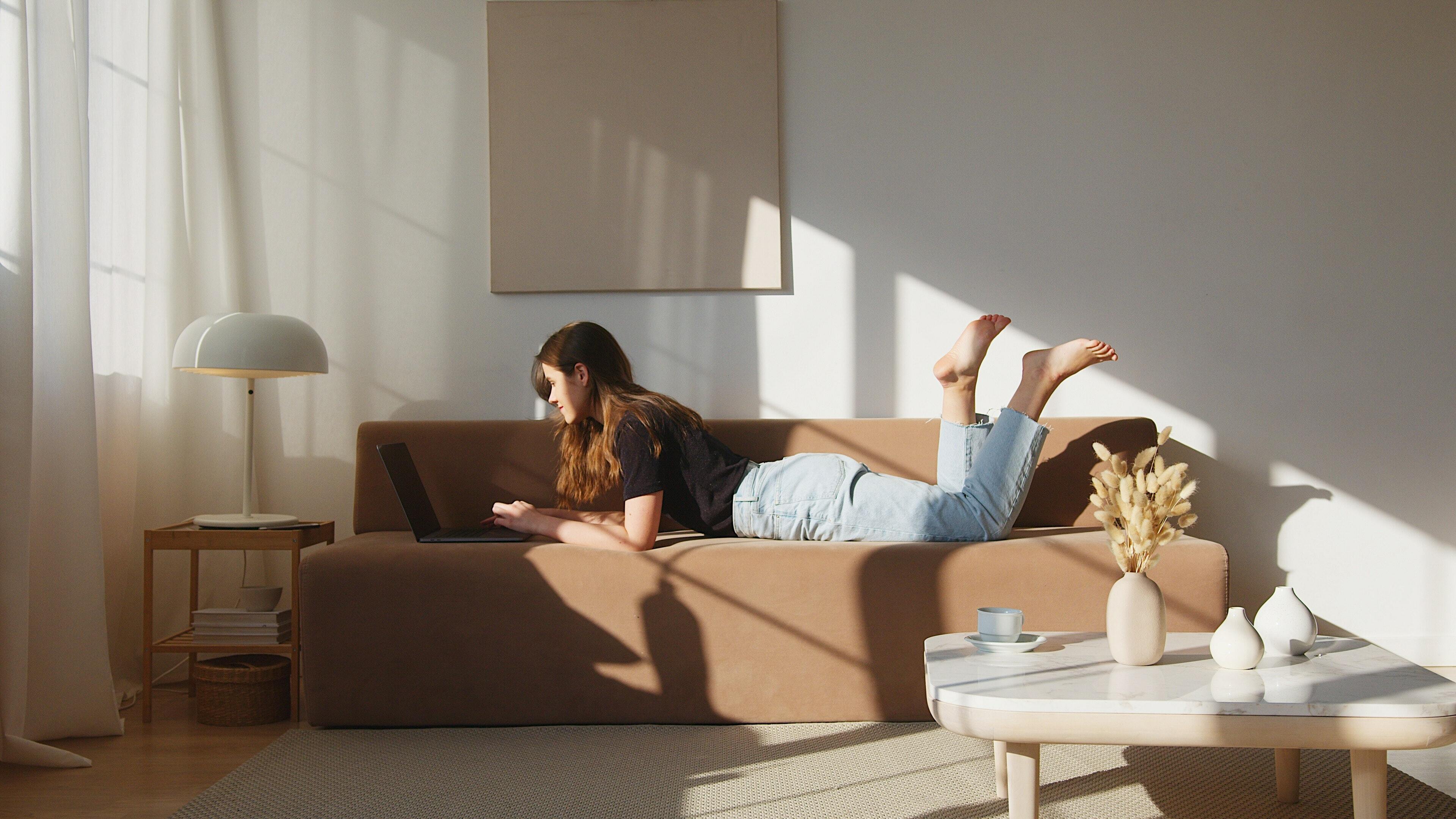 Person lying on sofa