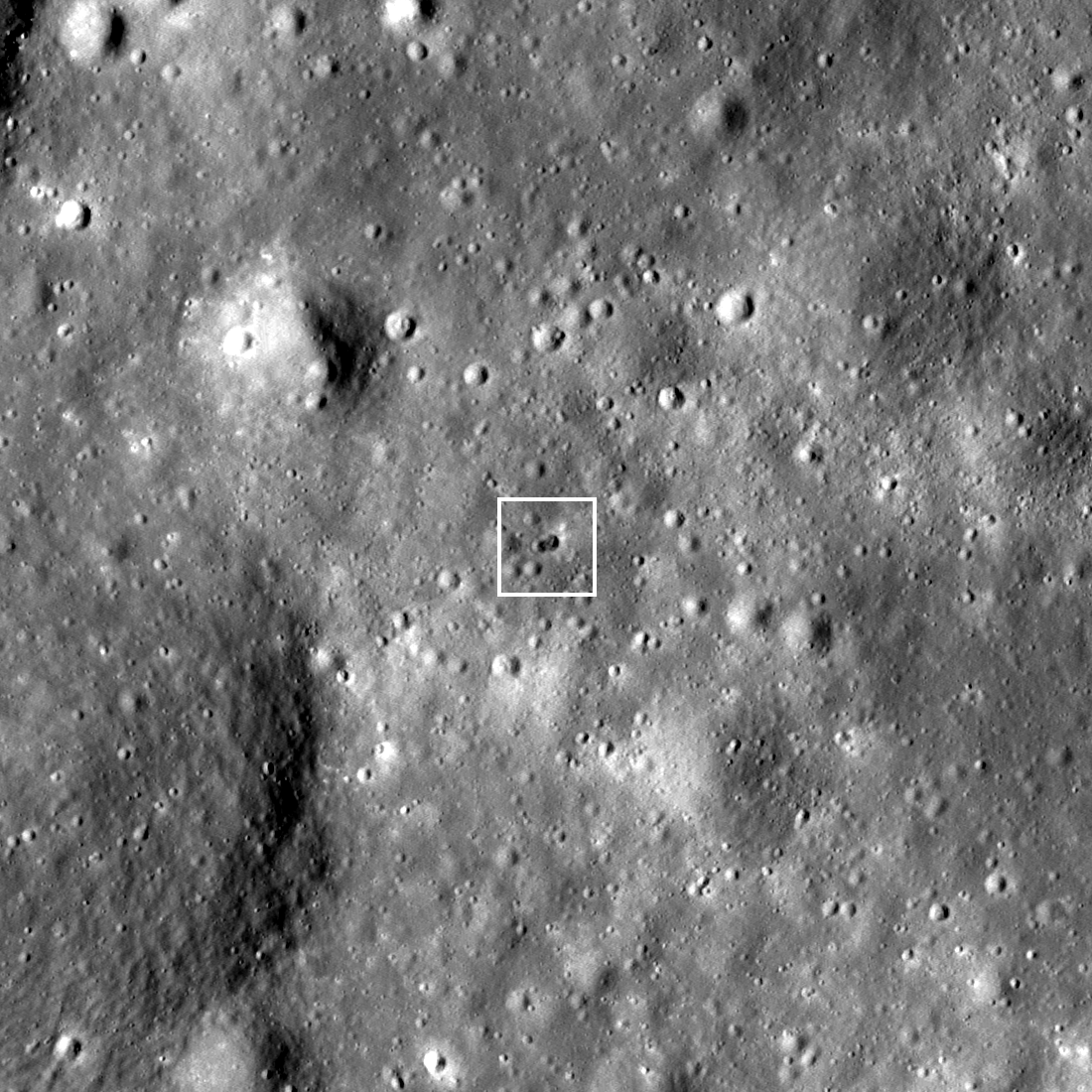 a double-crater on the moon from a rocket impact