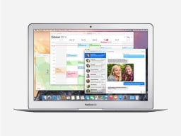 Silver macbook with imessage, calendar, and maps open