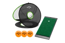 Green putting green with three orange golf balls and a mesh net with hole