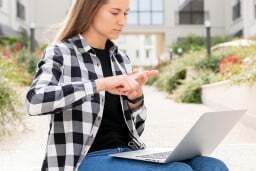 Girl signing at laptop