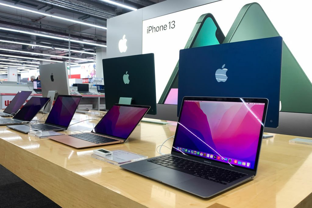 Row of Macs on display at store