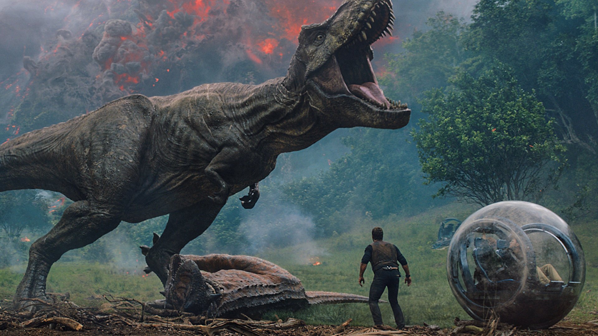 A T-Rex roars over a dead Ankylosaurus and a man standing beside an orb car.